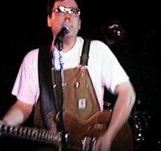Picture of John Flansburgh in overalls